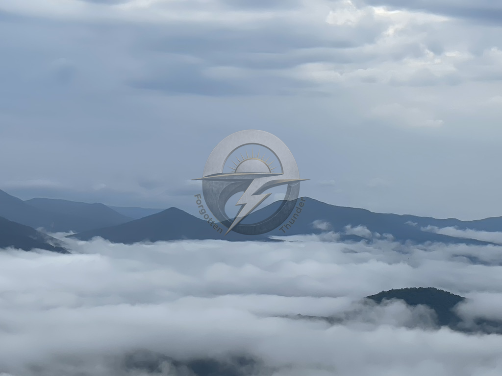 Blue ridgelines above a sea of clouds